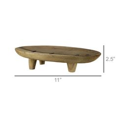 a wooden bench sitting on top of a white wall next to a ruler and measurements