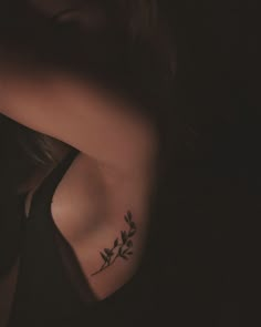 a woman with a tattoo on her shoulder