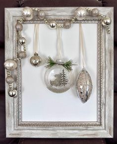 a white frame with ornaments hanging from it