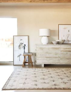 a living room scene with focus on the dresser and sideboard in the foreground