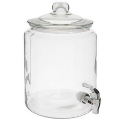 a clear glass jar with a metal faucet