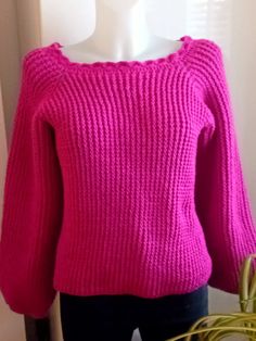 Crochet sweater is a perfect fuchsia pink colour off the shoulder top, with long sleeves. Look great with jeans trousers or skirt brighten up your autumn and winter months.  This sweater ready to ship in a Size:  Medium 12-14 UK            Medium  40-42 EU            Medium    8-10 US  Material:  100% Acrylic Care Instructions:  Machine Wash 40oC Hand Wash 40oC Pink Crochet Tops For Fall, Pink Knitted Long Sleeve Top, Pink Long Sleeve Knitted Top, Winter Casual Pink Crochet Top, Pink Casual Crochet Top, Casual Pink Crochet Top For Winter, Pink Stretch Knit Sweater, Stretch Pink Knit Sweater, Casual Pink Crochet Sweater