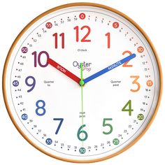 a white clock with colorful numbers on it