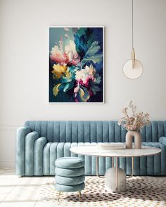 a living room with blue velvet couches and round tables in front of a painting on the wall