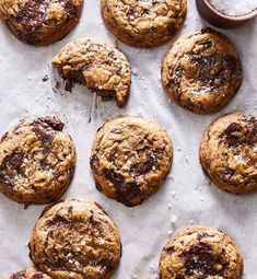 chocolate chip cookies are arranged on a baking sheet