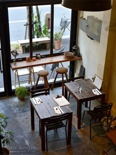 an overhead view of a restaurant with tables and chairs in front of a large window