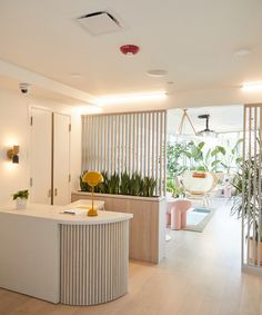 the interior of a modern home with white walls and wood flooring