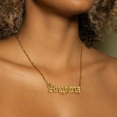 Our popular Golden Double Plated Gothic Name Necklace boasts a chic and elegant design, handcrafted to perfection. The model showcases the necklace with a 16-inch Figaro chain (see video for reference). You can personalize this item with Letters, Numbers, and Roman Numerals and choose from chain lengths of 14", 16", 18", and 20". Each chain features a lobster clasp closure for secure wear.Chain width:Cuban Chain - 3.7 mmFigaro Chain - 3 mm Closure: All chains are fitted with a lobster clasp Meta Silver Jewlery, Dainty Initial Necklace, Ring Bracelet Chain, Name Earrings, Engraved Pendant, Golden Necklace, Photo Pendant, Figaro Chain, Name Jewelry