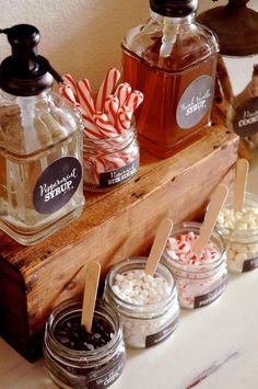 jars filled with candy and marshmallows sit on a shelf