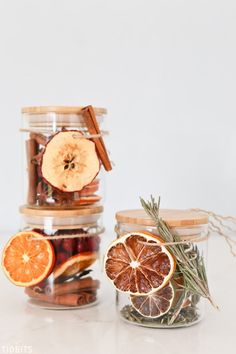 three jars filled with dried fruit and spices