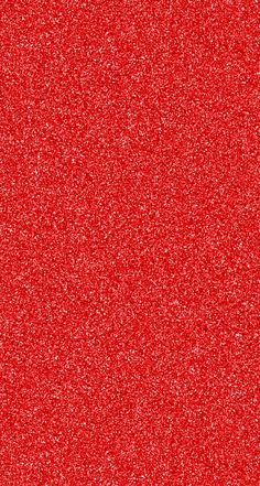 red glitter textured paper with small dots on the bottom and bottom corner, as well as