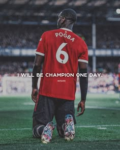 a man standing on top of a soccer field with the words pogba 6 will be champion one day