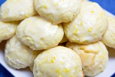 a white plate topped with lemon cookies covered in icing