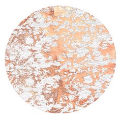 an orange and white round rug on a white background with some brown spots in the middle