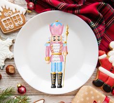 a plate with a nutcracker on it surrounded by christmas cookies and other decorations