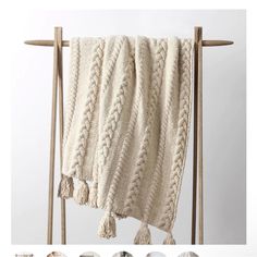 an image of a blanket hanging on a clothes rack with the text overlaying it