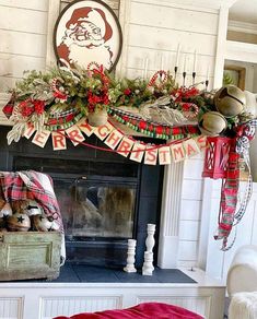 a fireplace decorated for christmas with stockings and hats