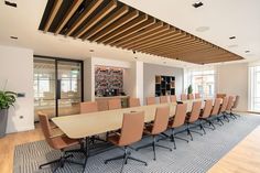 a conference room with long tables and chairs