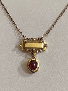 This solid 9 ct yellow gold bar necklace features a rhodolite cabochon garnet set in solid 9 ct yellow gold . It's bohemian perfectly imperfect charm is unique , it has been handmade and designed in a small artisan studio . The chain is gold plated silver . Wizard Jewelry, Kei Jewelry, Gold Bar Necklace, Garnet Necklace, Funky Jewelry, Stacked Jewelry, Rhodolite Garnet, Gold Bar, Jewelry Inspo