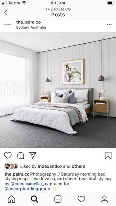 a bed room with a neatly made bed and two pictures on the wall above it