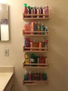 the bathroom shelves are filled with different types of toiletries