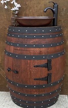 a wooden barrel with a sink and faucet