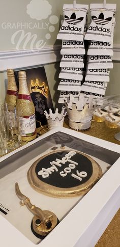 a table topped with cake and champagne bottles