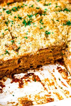 a casserole dish with meat and cheese on top, ready to be eaten