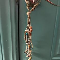 a door handle with some beads hanging from it