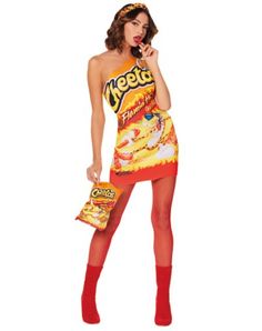 a woman dressed in a cheetos costume holding a candy bar bag and posing for the camera