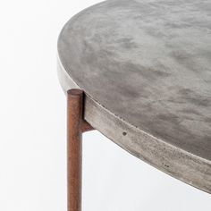 a metal table with wooden legs on a white background, closeup view from the top