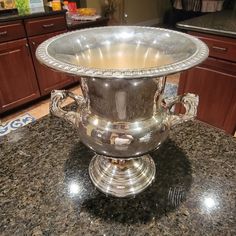 a large silver bowl sitting on top of a counter