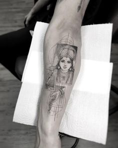 a person with a tattoo on their leg