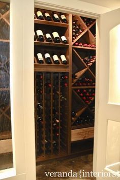 a wine cellar with many bottles in it