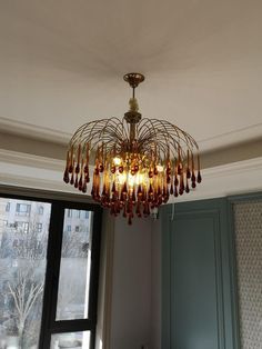 a chandelier hanging from the ceiling in a room