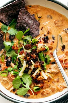 a bowl filled with soup and tortilla chips