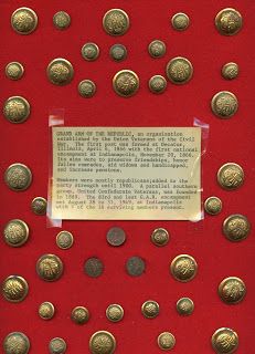 a display case with lots of gold coins on it and a note in the middle