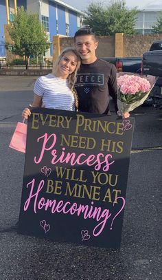 two people holding a sign that says every prince needs princesses will you be mine at home coming?