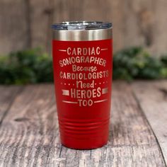 a red tumbler cup with the words human resources on it sitting on a wooden table