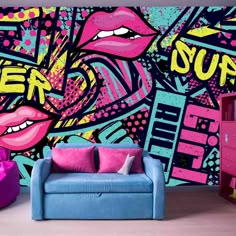 a couch sitting in front of a colorful wall