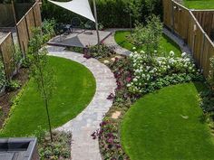 an aerial view of a garden with green grass