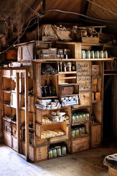 an old wooden storage unit with lots of items on it's shelves and drawers