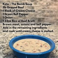 a blue bowl filled with soup sitting on top of a counter