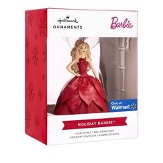 a barbie doll in a red dress with snowflakes on it's head