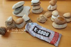 a bag of food sitting on top of a wooden table next to rocks and pebbles