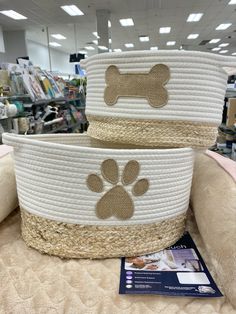 two baskets with dogs paw prints on them