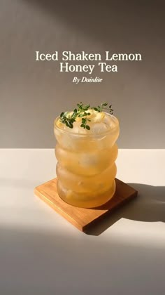 iced shaker lemon honey tea on a cutting board with the words iced shaker lemon honey tea