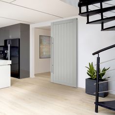 an open kitchen and living room with stairs