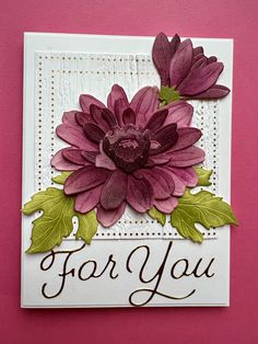 a close up of a card on a pink surface with flowers and words that say for you