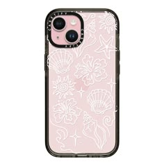 an iphone case with white flowers and seashells on the pink background, is shown